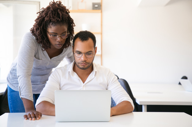 diverse-colleagues-watching-presentation-computer_74855-1791