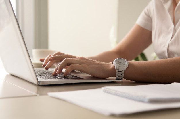 womans-hands-typing-laptop-workplace_1163-4324